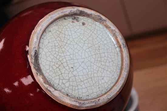 A Chinese blue and white sleeve vase, similar bowl and a sang de boeuf vase